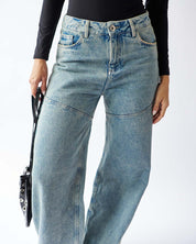 UNCOVERED JEANS