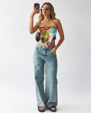 UNCOVERED JEANS